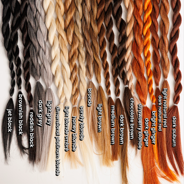 Collection of braided hair extensions in various colors with labels.