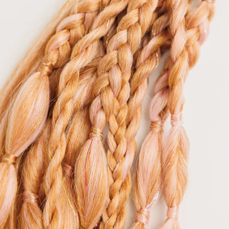 Braided hair extensions in a light brown color on a white background
