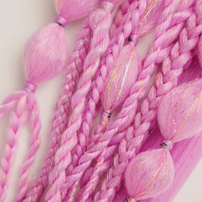 Close-up of pink braided hair extensions on a light background