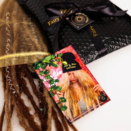 Black hair extensions with a packaging card featuring a model with blonde boho hair on a white background.