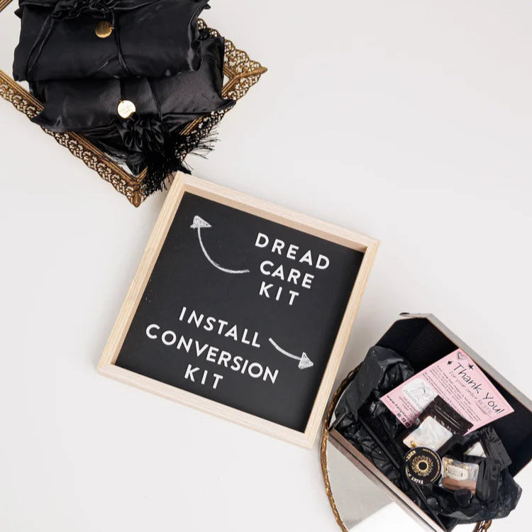 Dread care kit with black hair extensions and a sign indicating installation and conversion services on a white background.