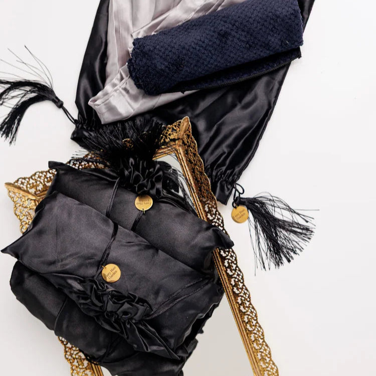 Fairy Hair Garden Dread Care Starter Kit with silk pillowcase, microfiber towel, and satin storage bag arranged on linen