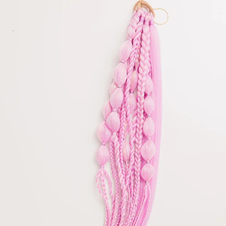 Pink braided hair extension with beads on a white background