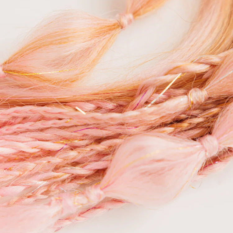 Close-up of pink and orange hair braids