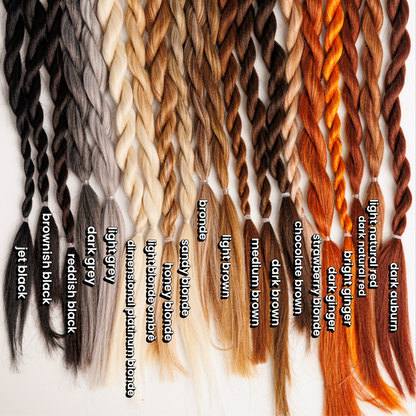 Collection of braided hair extensions in various colors with labels.