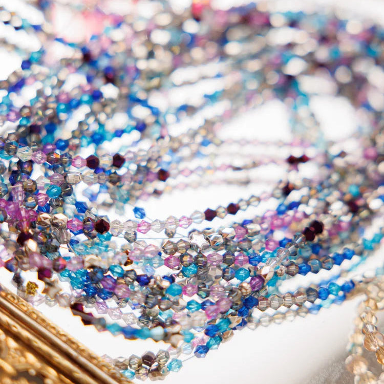 Close-up of multicolored beaded bracelets on a blurred background