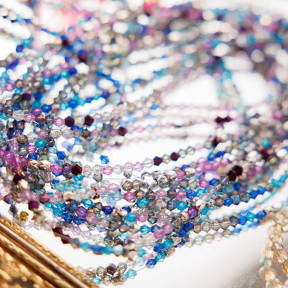 Close-up of multicolored beaded bracelets on a blurred background