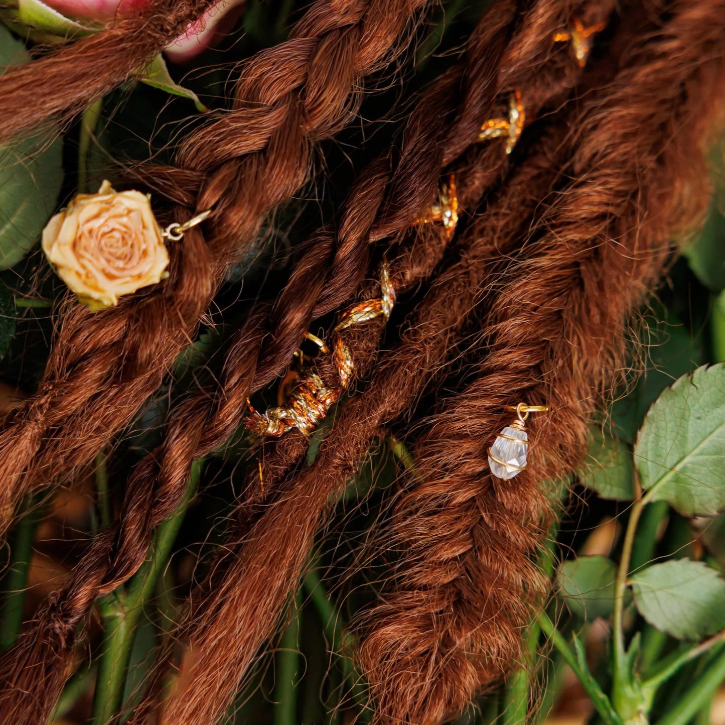 dark natural red boho braids and dreadlocks with rose accents and subtle shimmer