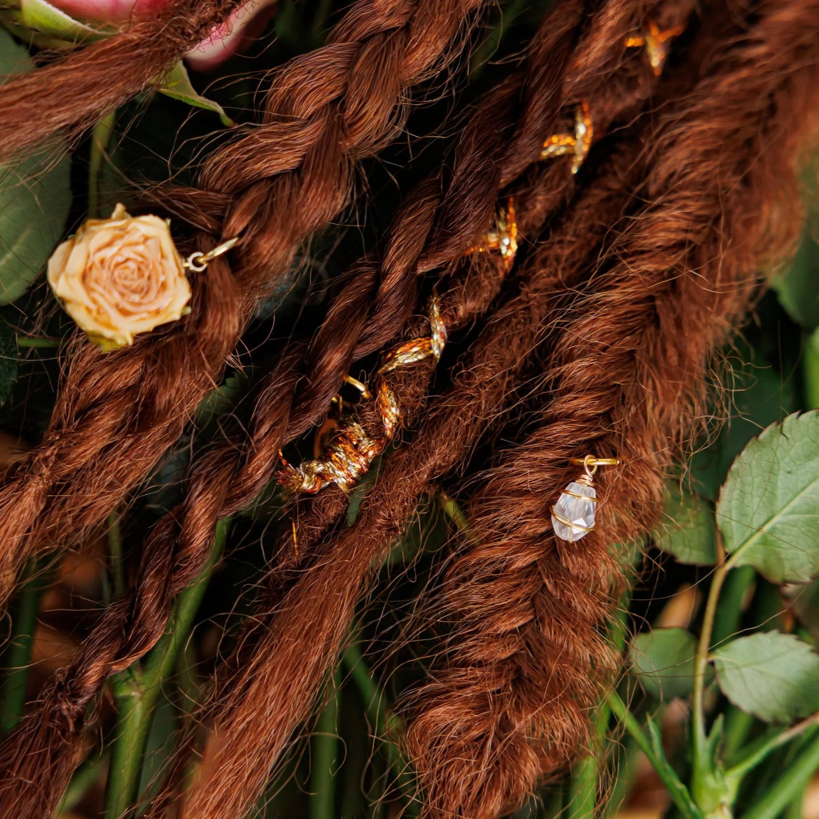 dark natural red boho braids and dreadlocks with rose accents and subtle shimmer